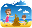 Boy and his mother at the Beach building sand castle