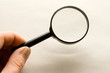 Magnifying glass in hand