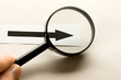 Magnifying glass in hand