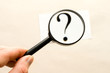 Magnifying glass in hand