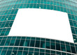blue glass wall with blank placard of skyscraper