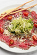 Beef carpaccio on a white plate