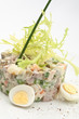 Salad olivier decorated on a white background