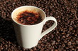 Cup of cappucino with coffee beans Cup of cappucino with coffee beans
