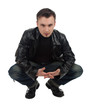 Photo: serious young man in leather jacket serious young man in leather jacket