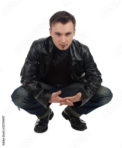 Photo: serious young man in leather jacket serious young man in leather jacket