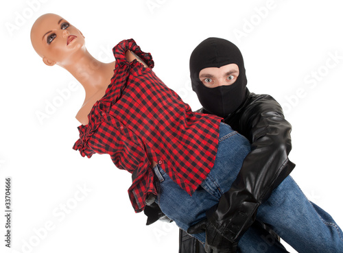 Photo: thief in black balaclava with manequin thief in black balaclava with manequin