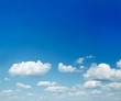 sparse clouds in the blue sky