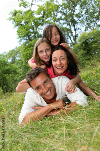 Photo: Portrait of happy family in countryside Portrait of happy family in countryside