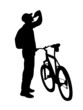 silhouette of young driver on mountain bike