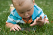 Child with telephone on the grass