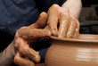 hands of a potter, creating an earthen jar on the circle hands of a potter, creating an earthen jar on the circle