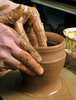 hands of a potter, creating an earthen jar on the circle hands of a potter, creating an earthen jar on the circle