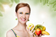 Young caucasian woman holding fruit