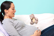 Pregnant woman watching Baby's first kick