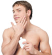 Man putting on cream lotion