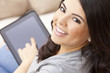 Happy Hispanic Woman Using Tablet Computer