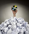 Hand with CD reaches out from heap of papers Hand with CD reaches out from heap of papers