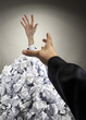 Helping hand saving buried businessman