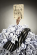 Businessman buried in crumpled papers Businessman buried in crumpled papers
