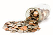 Jar Of US Coins Spilled On A White Background