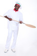 young black pizza cook taking a spade