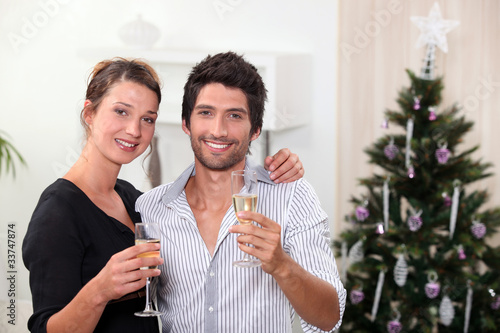 Photo: young couple celebrating New Year's Eve young couple celebrating New Year's Eve