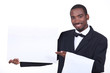 Studio shot of a waiter with a board left blank for your image