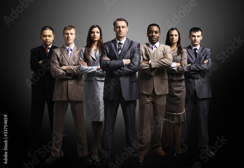 Photo: business team formed of young businessmen business team formed of young businessmen