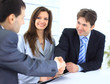 Business people shaking hands, finishing up a meeting