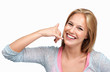 Happy woman making call me gesture