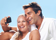 Young couple taking self portrait Young couple taking self portrait