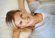 Lovely lady enjoying music on couch