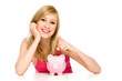 Woman putting coin in piggy bank