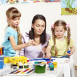 Child painting in preschool.