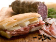 focaccia with speck and cheese over cutting board focaccia with speck and cheese over cutting board