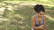 Smiling student sending text message