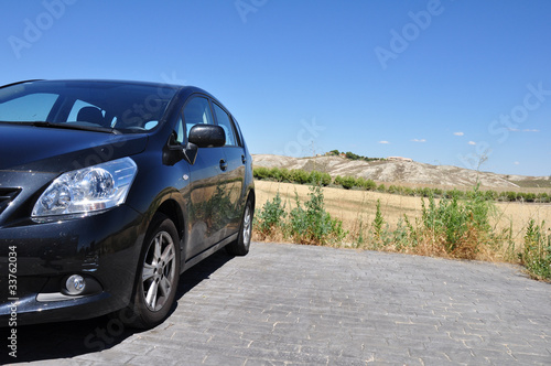 Photo: black car parked on the road black car parked on the road