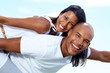 Joyful young couple enjoying themselves on holiday