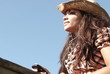 Listening to music in slow motion against blue sky