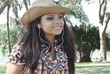 Pretty woman listening to music at park - Slow motion