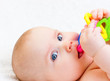 Infant with teething toy