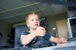 boy is playing with the computer