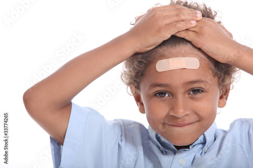 Photo: Little boy with plaster on head Little boy with plaster on head