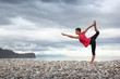 Photo: Yoga outdoors on lake beach. Copyspace. Yoga outdoors on lake beach. Copyspace.