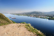 Wide river view with several barges floating over it