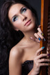 Woman with professional colourful make-up and sparkling manicure
