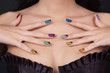Hands with perfect sparkling colourful manicure