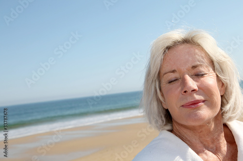 Photo: Portrait of happy senior woman in spa resort Portrait of happy senior woman in spa resort