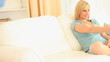 Young woman switching channel